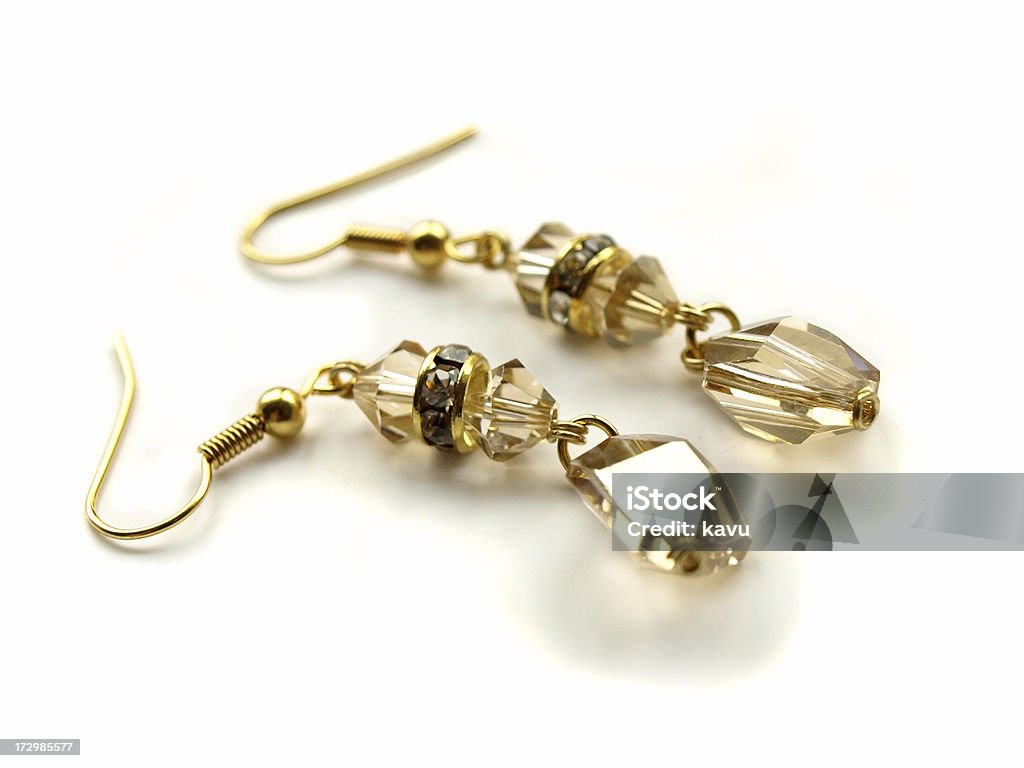 Złoty cień kryształów Swarovskiego złote kolczyki - Zbiór zdjęć royalty-free (Kolczyk - Biżuteria)