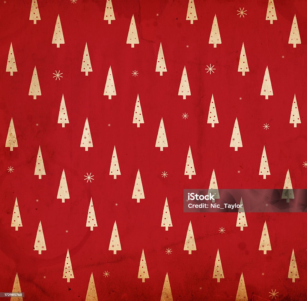A red and white retro Christmas background Image of an old, grungy piece of XXL paper with a red wrapping-paper looking pattern of christmas trees and snowflakes. See more quality images like this in my portfolio and in my Retro Christmas Backrounds Lightbox.  Christmas Stock Photo