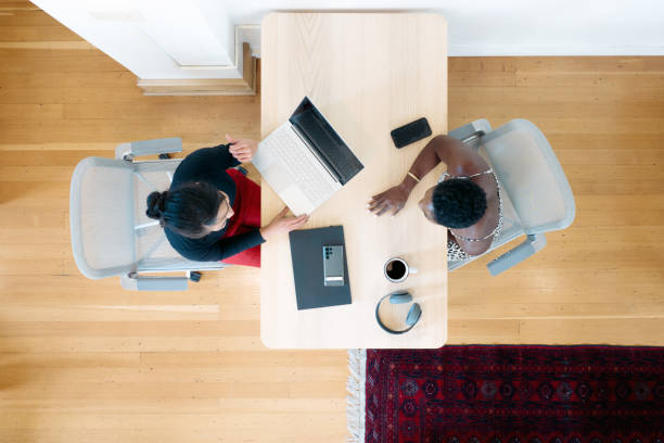 istock High Overhead View of Desk Meeting at Modern Office Space 1729863634
