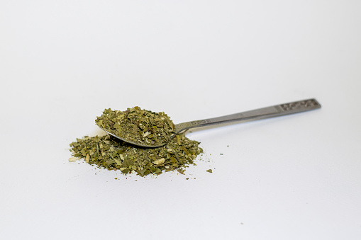 Spoon with yerba mate to prepare traditional Argentine infusion.