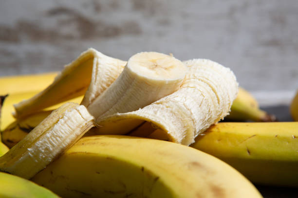 istock A bunch of bananas, placed on wooden table. 1729870074