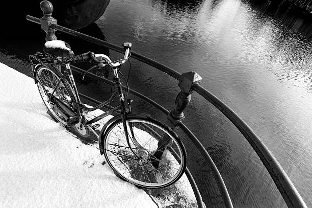 Bicycle and snow in Amsterdam stock photo
