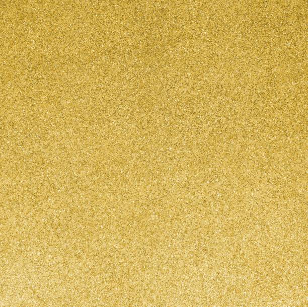 istock GOLDEN GLITTER sparkling background with bright reflections and many small lights 1729874299
