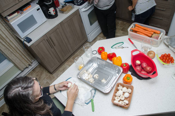 istock One mature woman preparing vegetables 1729874605