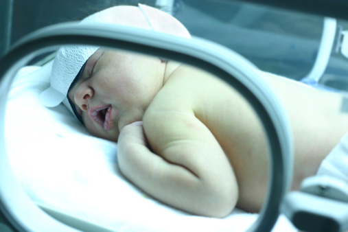 Baby with jaundice under uv lights at hospital