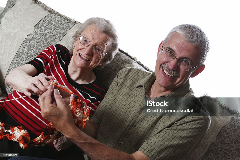 Learning to Crochet Man learning to crochet from his mother 70-79 Years Stock Photo