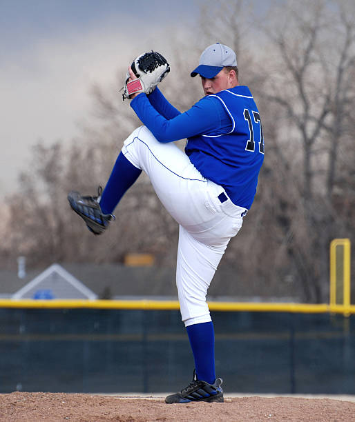 istock A baseball pitcher in blue getting ready to throw 172988750