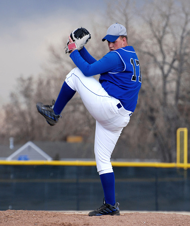 A baseball pitcher is in full windup.Please see some similar pictures from my portfolio: