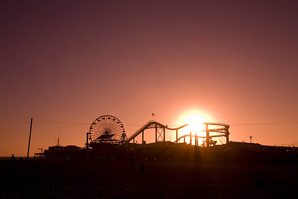 istock Santa Monica Pier with the Sun Setting Behind it 172989100
