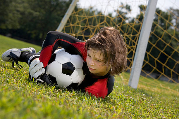 istock soccer goalie makes a save 172989185