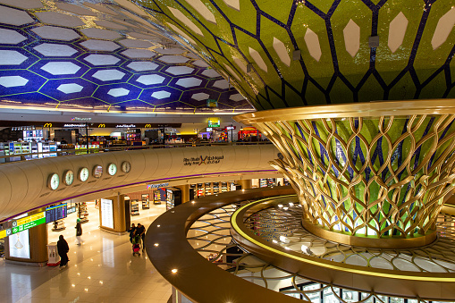 Abu Dhabi, UAE - May 29, 2023: Interior of luxury Abu Dhabi International airport. Terminal 1. United Arab Emirates