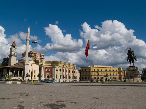 Statue of Skanderbeg (national hero of the Albanians), Ethem Bey mosque and the clock tower in Skanderbeg Square, Tirana.