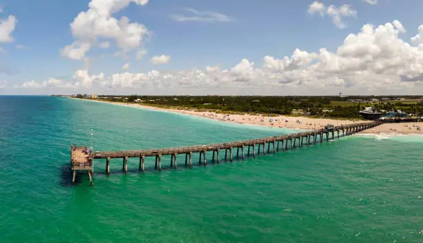 Photo of Bright ocean landscape at Venice fishing pier in Florida, USA. Popular vacation place in south