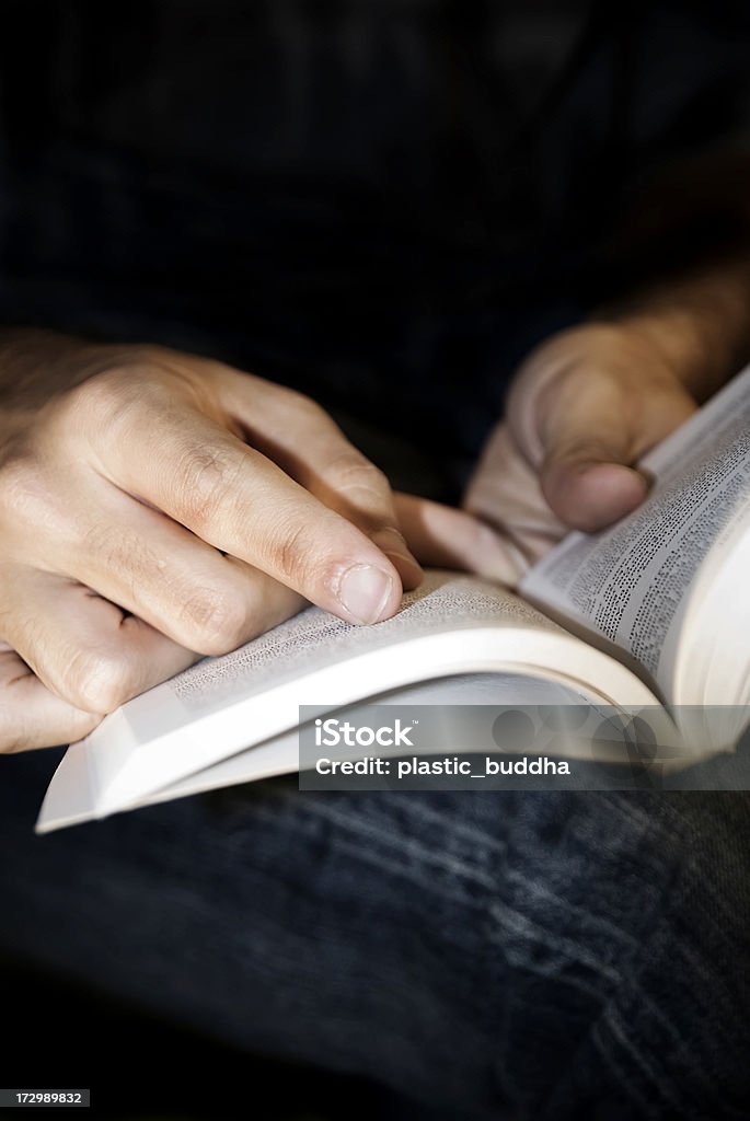 reading reading pointing with the hands,copy space above ,selective focus  (process in photoshop,vignetting) Adult Stock Photo