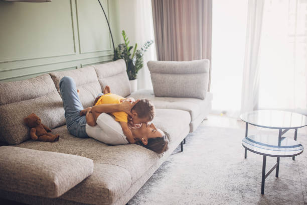 istock Mom and son relaxing on sofa 1729904669