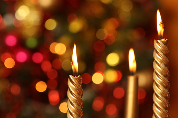 istock Christmas Candles with Lights and Tree in Background 172991026
