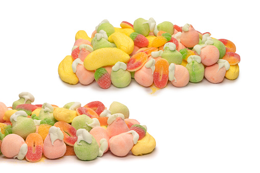 Mix of jelly colorful candys and marshmallows isolated on a white background.