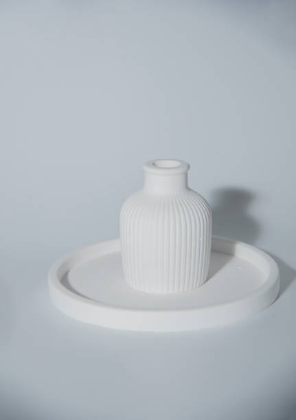 istock Small white ceramic vase.handmade symbolic ceramic figurines.Cozy home natural eco decor 1729912969
