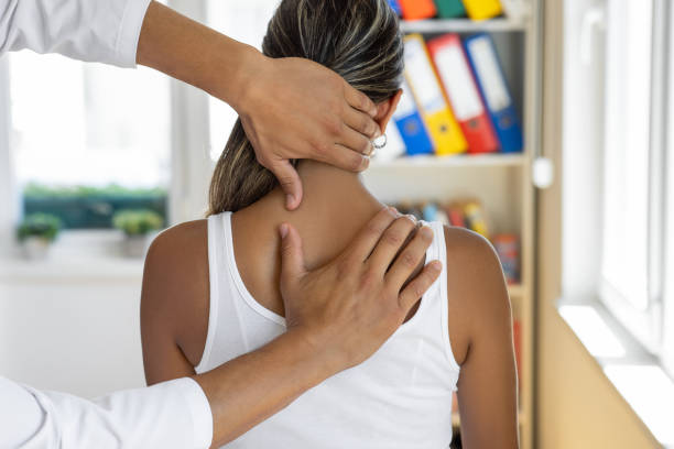 Physiotherapist massage therapist Physiotherapist massage therapist chiropractor stock pictures, royalty-free photos & images