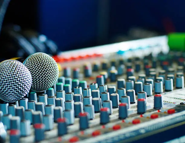 Photo of Close-up of an audio mailing board and microphones