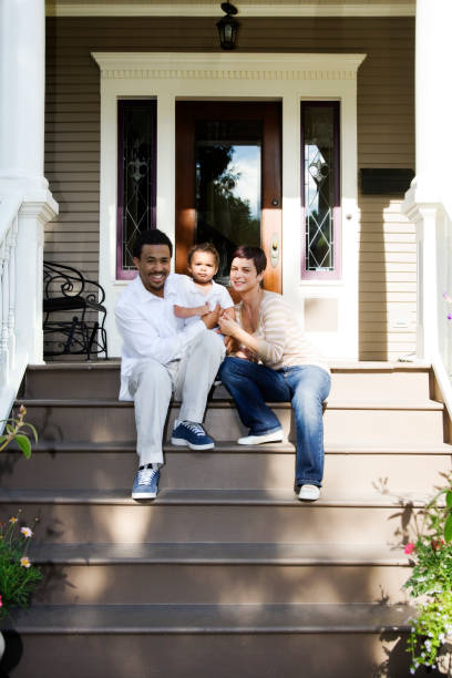 istock Happy Family of Three at Home on Front Steps 172992369