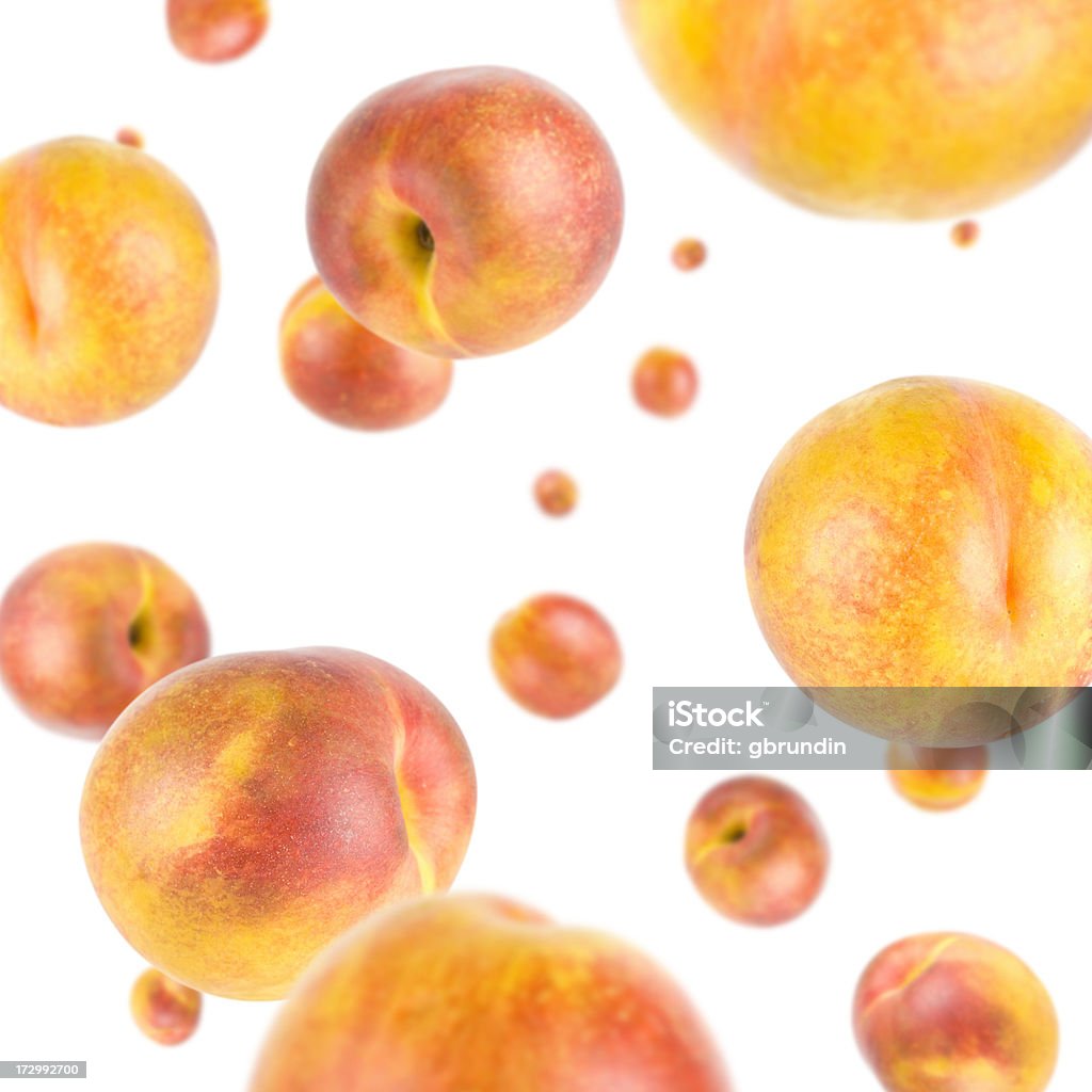 Peach Explosion Many fresh peaches on white background. XXL Mid-Air Stock Photo