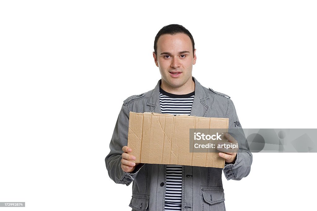 Jovem atraente homem segurando em branco cartaz de pacote - Foto de stock de Sinal royalty-free
