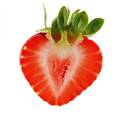 sliced cross section of a strawberr against white