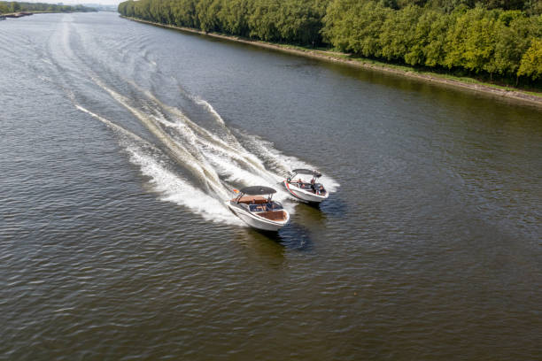 istock Two small boats sailing at high speed on calm waters 1729930977