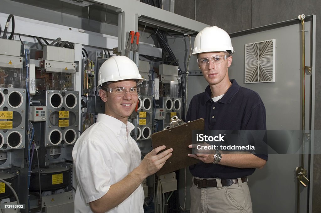 Contract Engineers Factory Engineers or OSHA Inspectors checking electrical circuits. Building Contractor Stock Photo