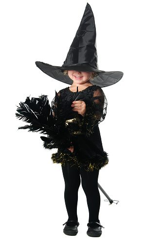 Young girl wearing a Mardi Gras costume. Studio shot, isolated on white background with room for text. 