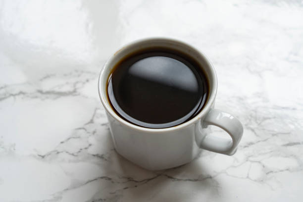 istock Cup of coffee on marble table 1729946561