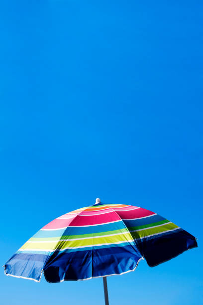 istock Vacation Holiday Bright beach umbrella with cool blue sky 172995445