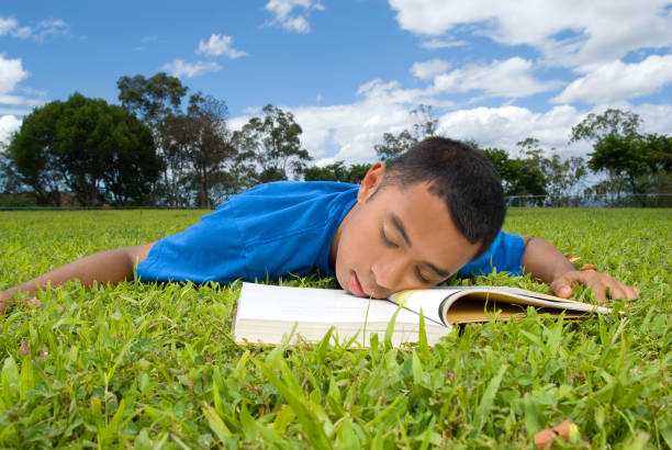 istock Young Asian man on the grass lawn. 172995451