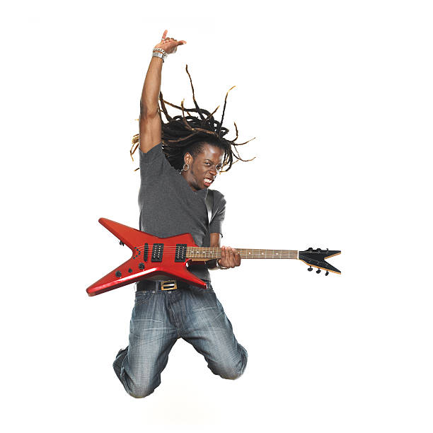 hombre tocando la guitarra eléctrica y paracaidismo - isolated on white studio shot guitar young men fotografías e imágenes de stock