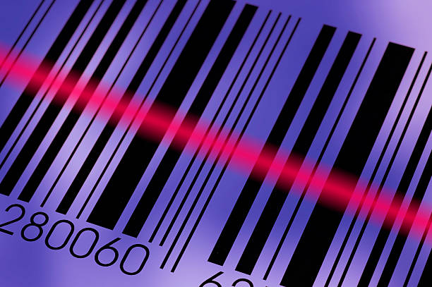 Diagonal photo of a barcode being read by the reader Barcode and laser beam macro laser pen stock pictures, royalty-free photos & images