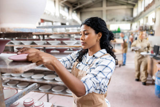 istock Employee doing quality control while working at a ceramics factory 1729965979