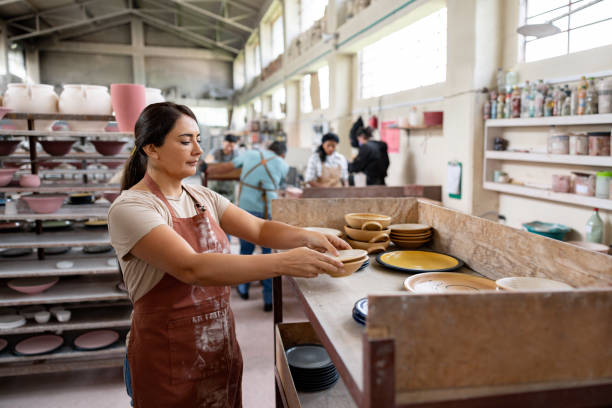 istock Woman working at a ceramics factory doing quality control 1729966317