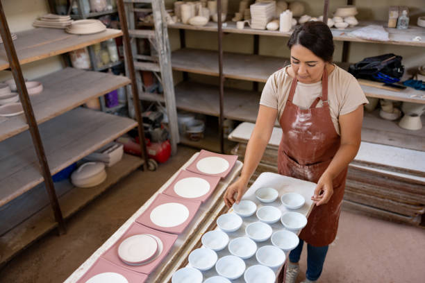 istock Woman working at a pottery factory doing quality control 1729966363