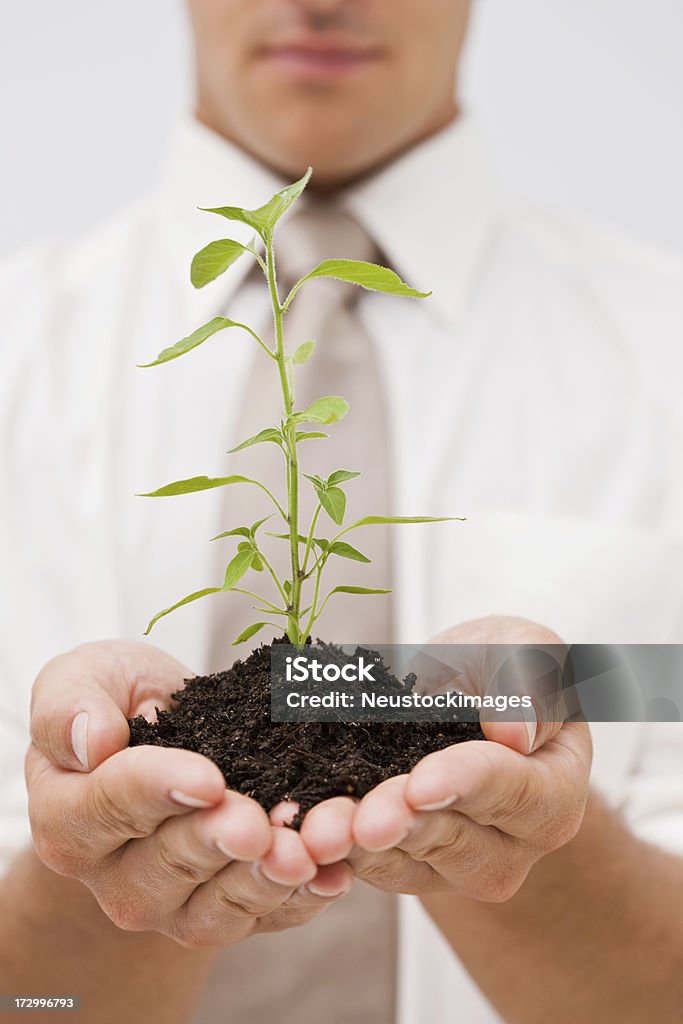 Homem segurando plantas - Royalty-free Adulto Foto de stock