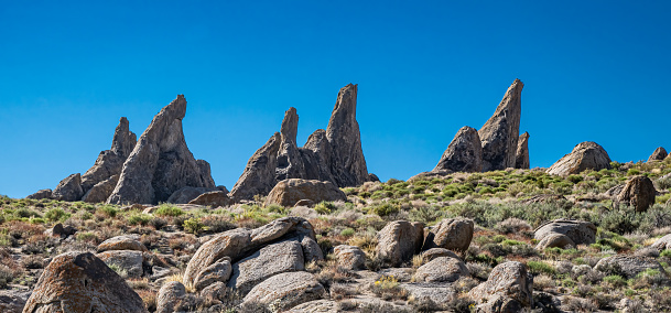 Magmatic Dike or dyke is a sheet of rock that is formed in a fracture of a pre-existing rock body. The Alabama Hills are a range of hills and rock formations near the eastern slope of the Sierra Nevada in the Owens Valley, west of Lone Pine in Inyo County, California. The Sierra Nevada Mountains are in the back round.