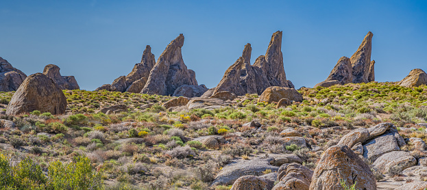 Magmatic Dike or dyke is a sheet of rock that is formed in a fracture of a pre-existing rock body. The Alabama Hills are a range of hills and rock formations near the eastern slope of the Sierra Nevada in the Owens Valley, west of Lone Pine in Inyo County, California. The Sierra Nevada Mountains are in the back round.