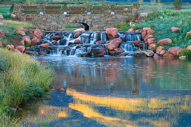 istock Landscaping Stone Bridge over Creek in fall with motion 172998523