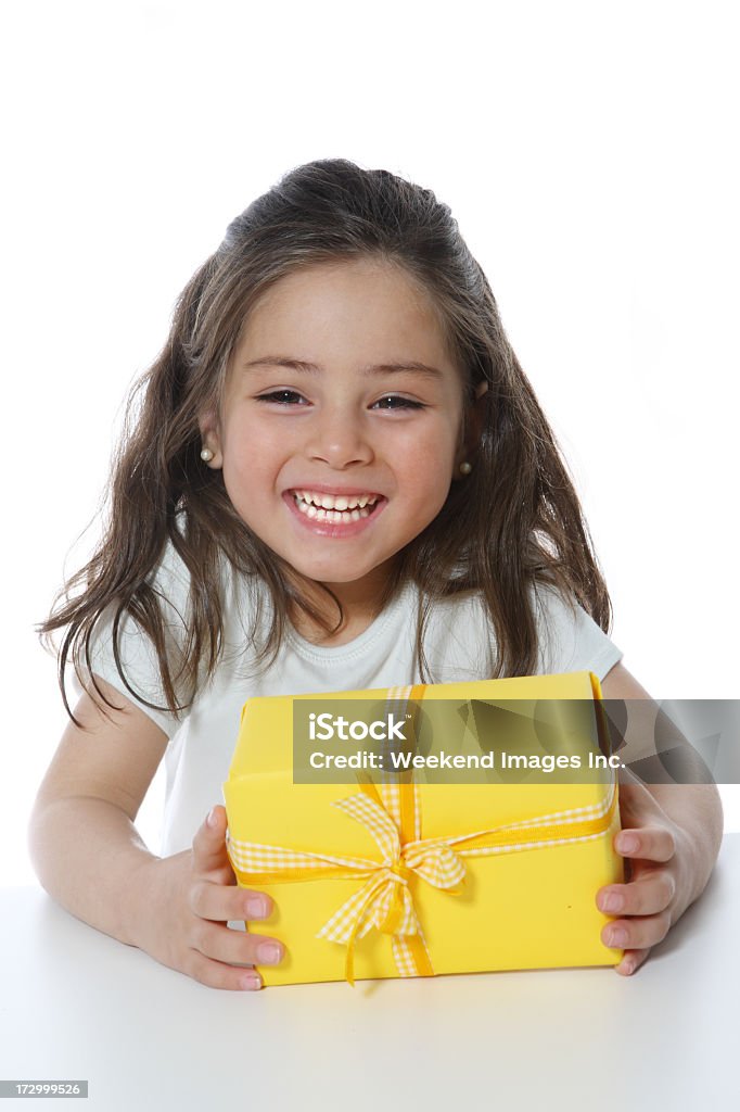 Happy girl with gift Smiling child Asian and Indian Ethnicities Stock Photo