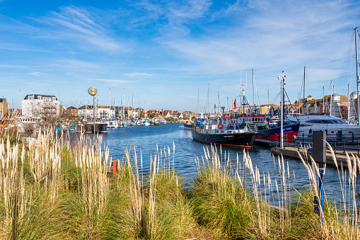 Eastbourne, England - Feb 12, 2022: The yachts in Sovereign harbour in the evening light in Eastbourne, East Sussex, Enlgand