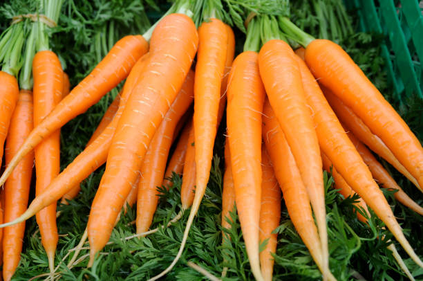 istock fresh carots at farmer's market 173001138
