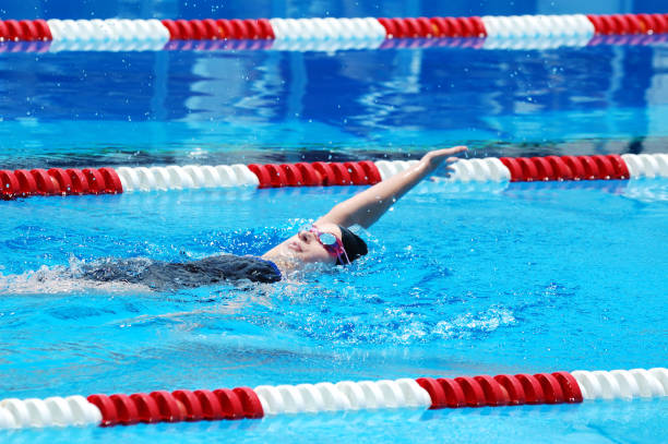 istock Young Girl Swimming Backstroke in Race 173001269