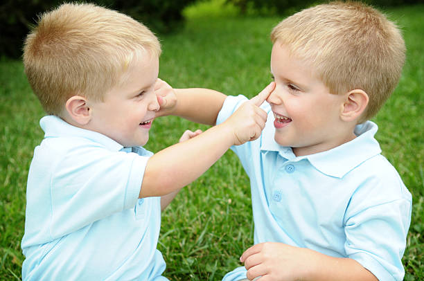 istock Twins Boys Playing Together Outside 173001665