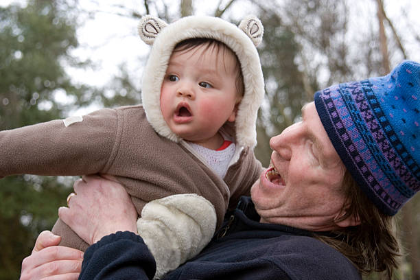 istock Father playing with baby son outdoors 173002950