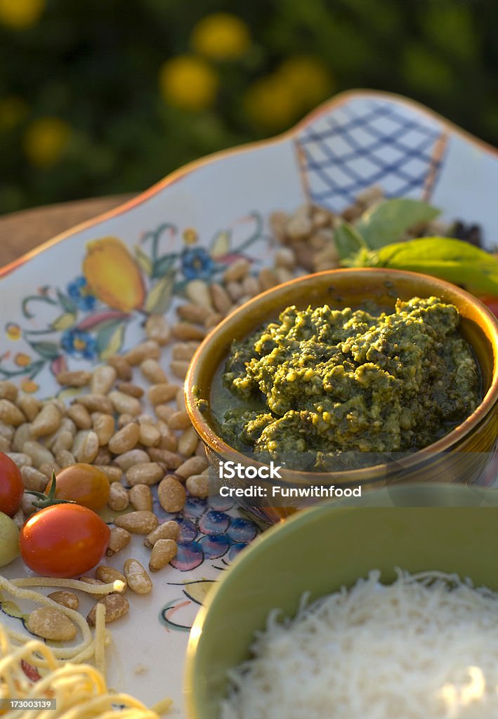 Cooking Ingredients, Basil Herb Pasta Pesto Sauce & Dip, Italian Food "Pasta pesto sauce ingredients; pine nuts, black pepper, fresh basil herb, Parmesan cheese, heirloom tomatoes & spaghetti. (SEE LIGHTBOXES BELOW for many more Italian food & cooking photos...)" Basil Stock Photo